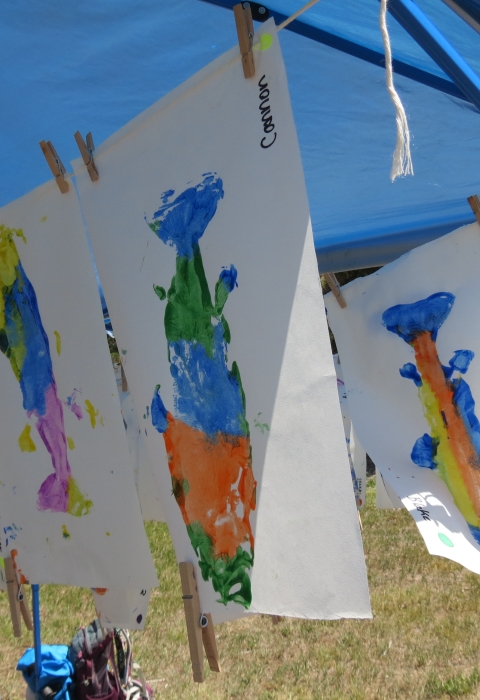 Colorful fish art hanging up to dry. 