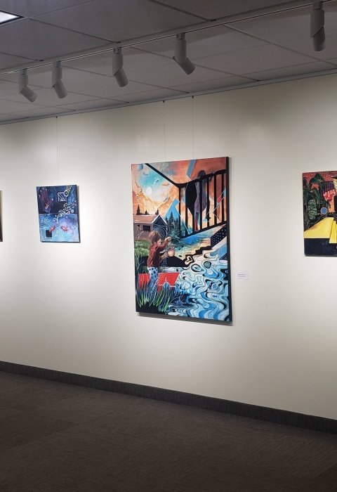 Several art pieces that make up the art exhibit Little Spirits. This pieces are primarily paintings, with some textural components. Moira's pieces show people interacting with nature and feature bright colors.