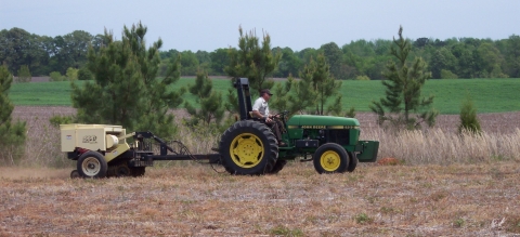 Tractor pulling bin for a no-till seed planting
