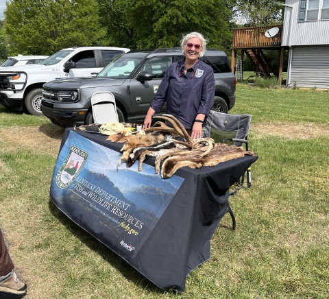 A lady set up with informational booth