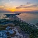 Aerial view of Waugoshance Point in Wilderness State Park on Lake Michigan at sunset in winter.