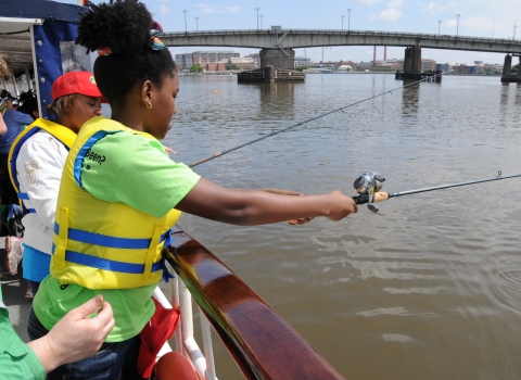 Young person fishing, Anacosta River, Washington, D.C. 