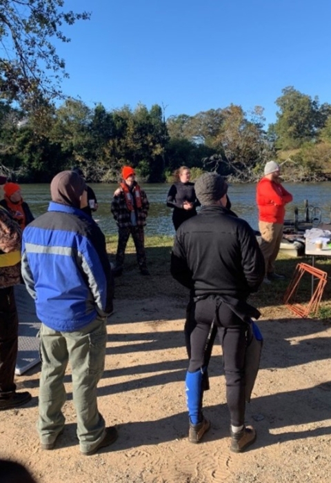 Group photo discussing safety protocols.