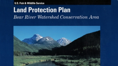 Book Cover with Land Protection Plan: Bear River Watershed Conservation Area written on it along with a picture of a river, a grassy river bank, and snowy mountains.