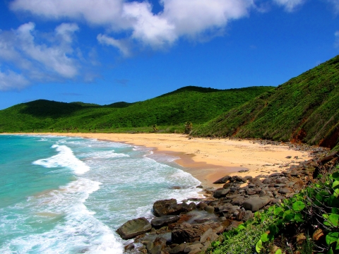 Blue waters lapping up on a beach at Culebra NWR