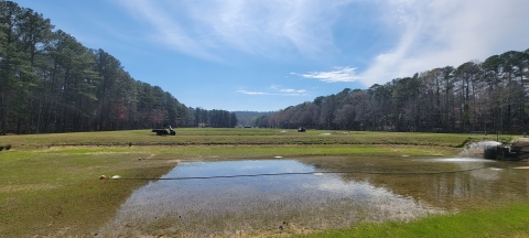 Picture of landscape with ponds and woods.