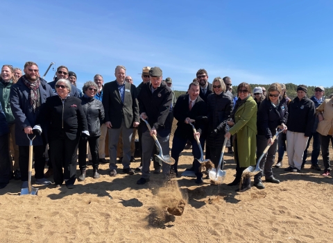 A group of people with shovels 