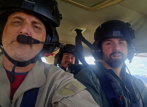 Aerial survey crew Zach Lyall (front right), Jeff Drahota (front left), and Trey McClinton in a plane