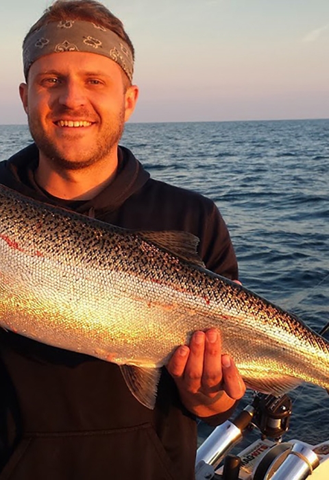 A man holding a large fish