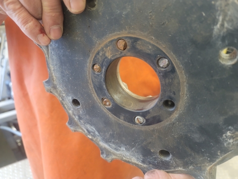 Chain drive gear sprocket with sheared bolts