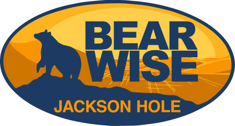 Bear Wise Jackson Hole logo showing outline of bear and shape of Jackson Hole behind it