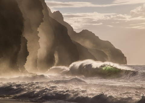 Waves crash against the coastline on Kauai