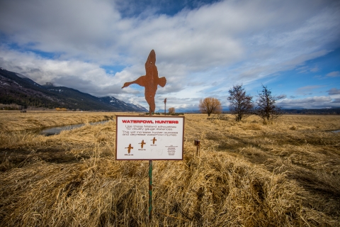 A sign denotes proper shooting distance for hunters