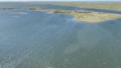 a lake with land in the background