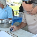 USFWS employee dabs superglue on freshwater mussels