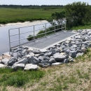Water control structure used to regulate the flow between water bodies and control the spread of aquatic invasive species.structure designed to control water entering Lake Erie.