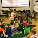 Fish and Wildlife staff conducting the Young Explorer's Club program for a group of children.