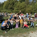 Group of kids smiling in front of stream
