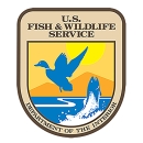 USFWS Logo with blue fish jumping out of water below a blue duck with the text U.S. Fish & Wildlife Service, Department of the Interior