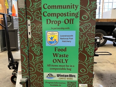 a green and brown metal container reads "communtiy composting drop-off"